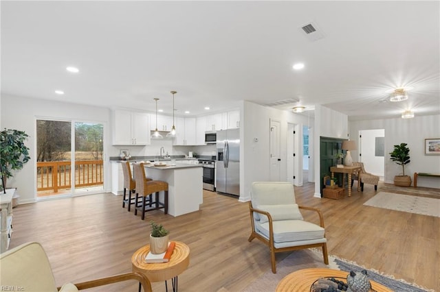 living room with light hardwood / wood-style floors