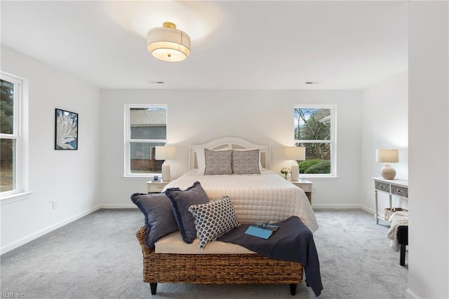 bedroom featuring light carpet