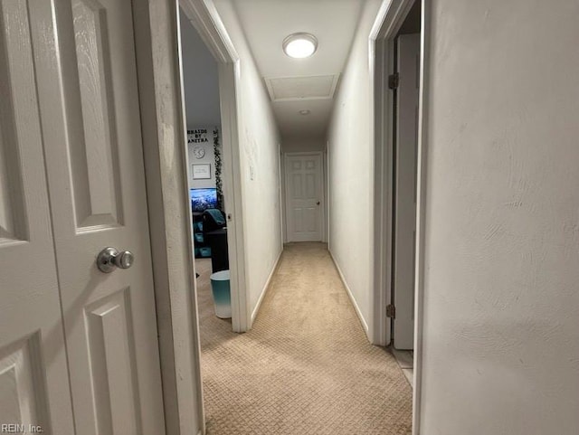 corridor with light colored carpet