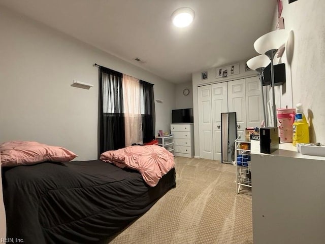 carpeted bedroom featuring a closet