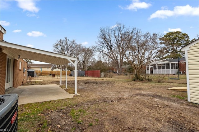 view of yard featuring cooling unit and a patio