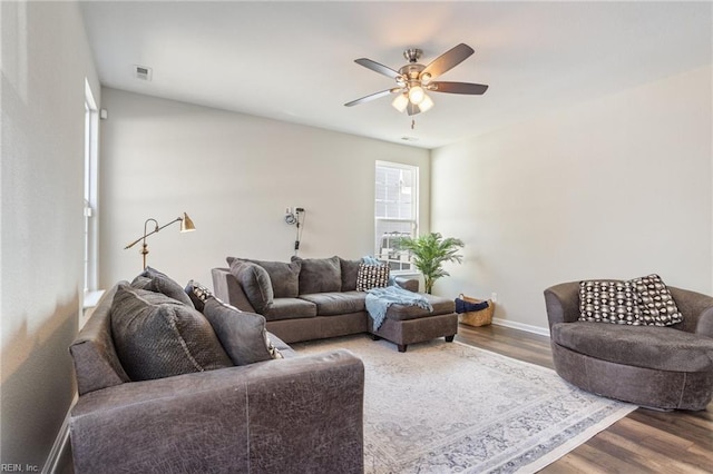 living room with ceiling fan and wood-type flooring