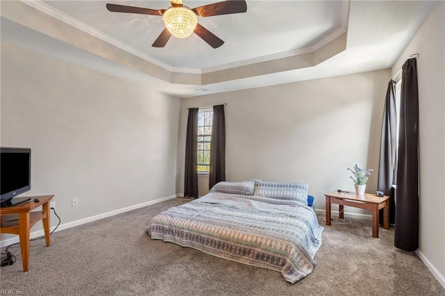 bedroom featuring crown molding, a raised ceiling, and carpet floors