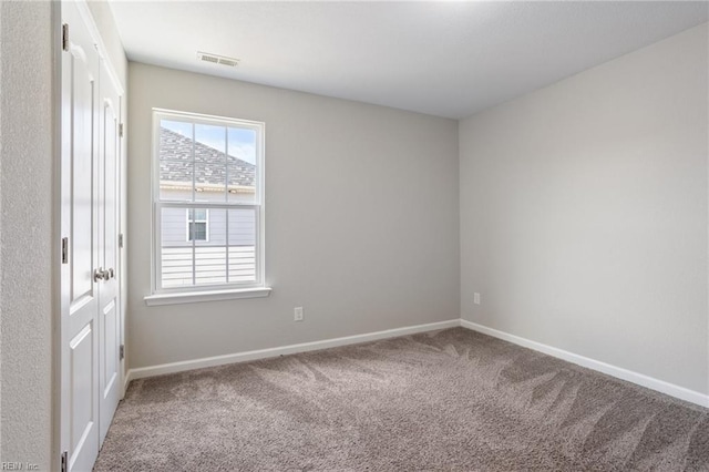 unfurnished room with carpet flooring