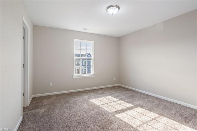 empty room with light colored carpet