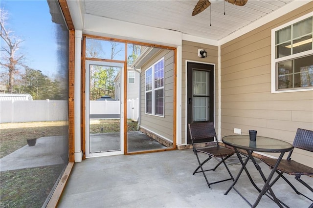 sunroom / solarium with ceiling fan