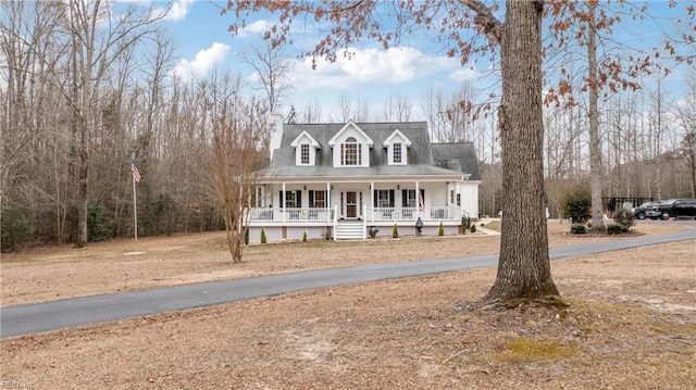 cape cod house with a porch