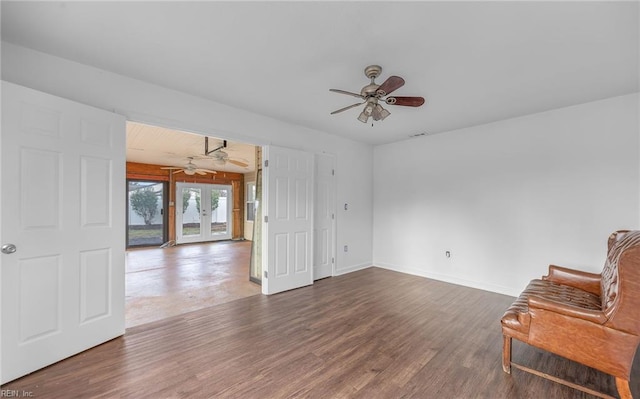 interior space featuring dark hardwood / wood-style flooring, french doors, and ceiling fan