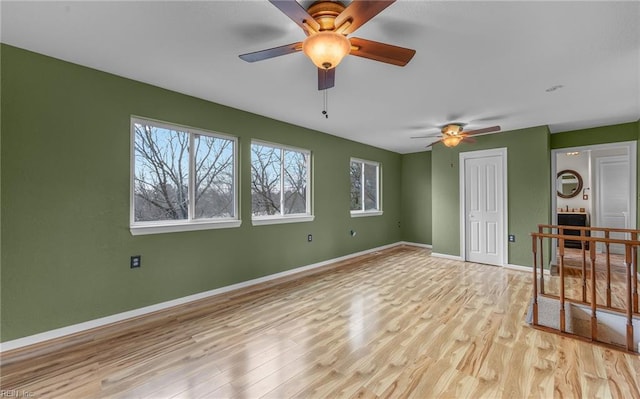 interior space with ceiling fan, a closet, and light wood-type flooring