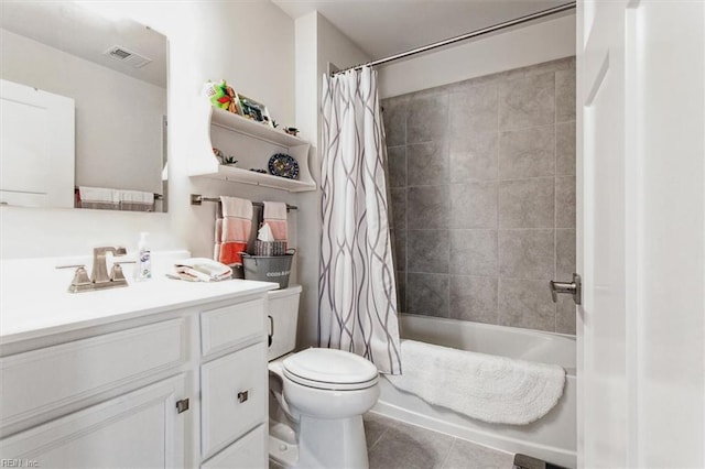 full bathroom featuring shower / bath combination with curtain, tile patterned floors, toilet, and vanity