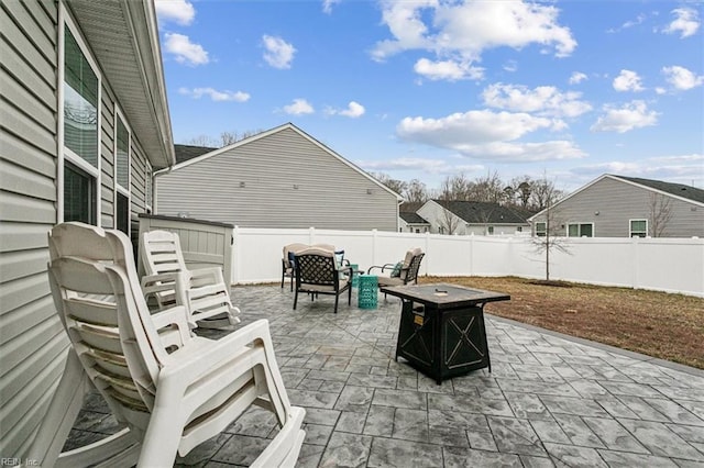 view of patio / terrace with a fire pit