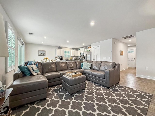 living room with dark hardwood / wood-style floors