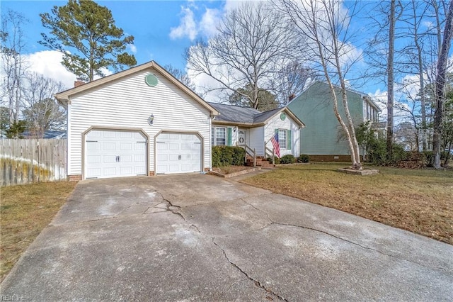 view of front of home with a garage and a front yard