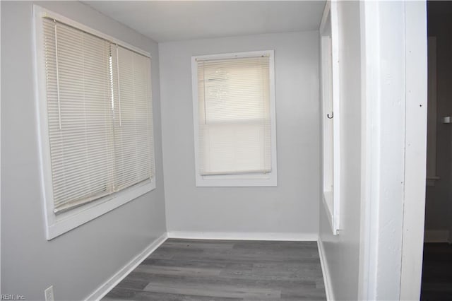 corridor featuring dark wood-type flooring