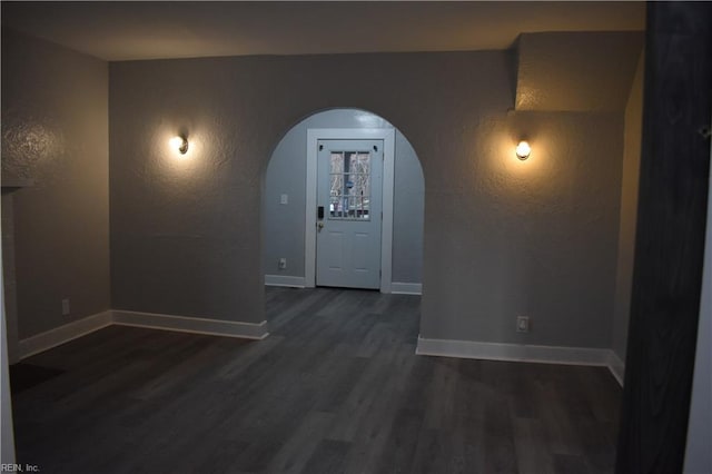 hall featuring dark wood-type flooring