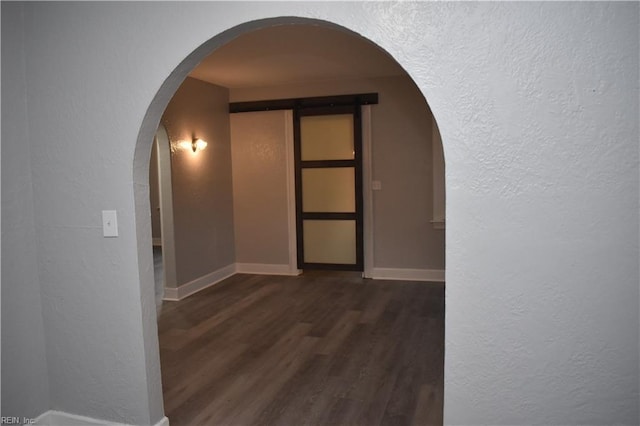 hallway featuring dark wood-type flooring