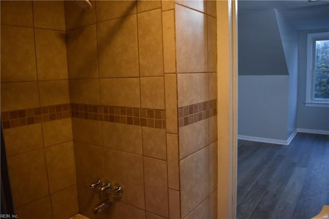 interior details with tiled shower / bath