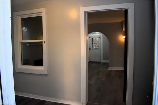 hallway featuring dark wood-type flooring