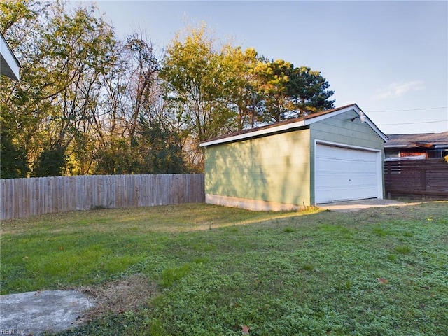 garage featuring a lawn