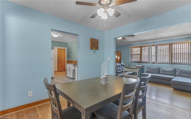 dining area featuring ceiling fan and light hardwood / wood-style floors