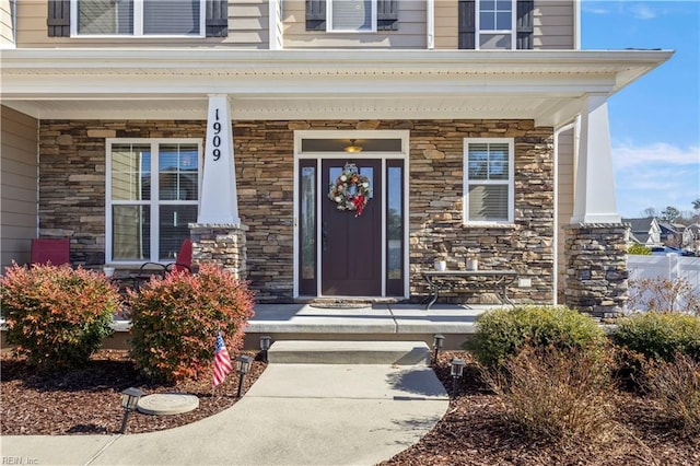 entrance to property featuring a porch