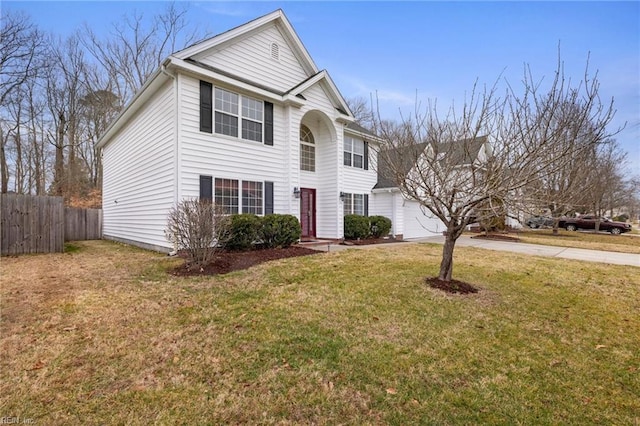 view of front property featuring a garage and a front yard