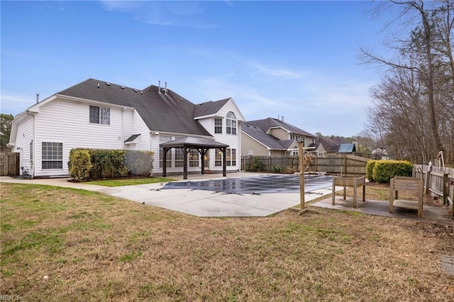 back of house featuring a yard, a gazebo, and a patio