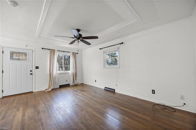 interior space featuring dark hardwood / wood-style floors, a raised ceiling, and ceiling fan