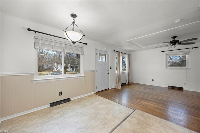 foyer featuring ceiling fan and wood-type flooring