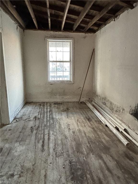 unfurnished room featuring hardwood / wood-style floors