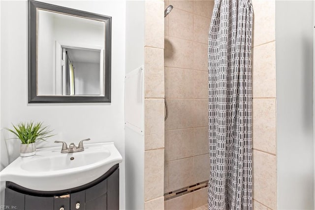 bathroom featuring vanity and a shower with shower curtain