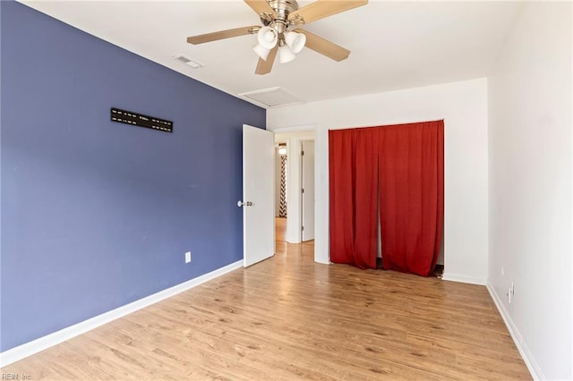 spare room featuring ceiling fan and light hardwood / wood-style floors