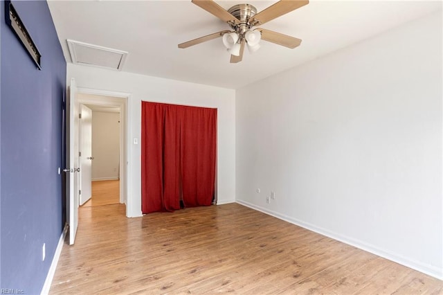 unfurnished bedroom with ceiling fan, light hardwood / wood-style floors, and a closet