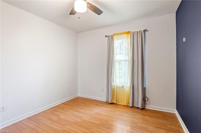 unfurnished room with ceiling fan and light hardwood / wood-style flooring