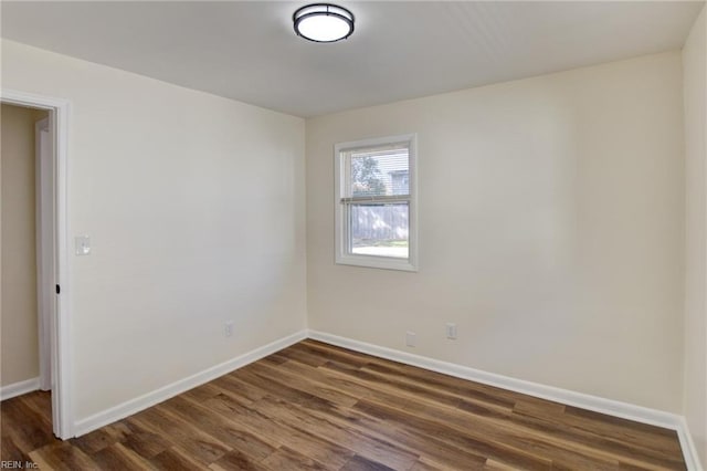 empty room featuring dark hardwood / wood-style floors