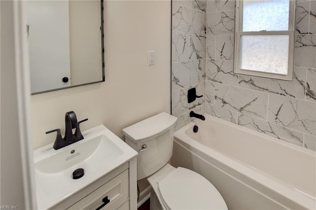 full bathroom with vanity, toilet, and tiled shower / bath combo