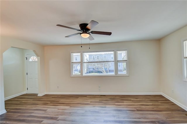 unfurnished room with hardwood / wood-style flooring and ceiling fan