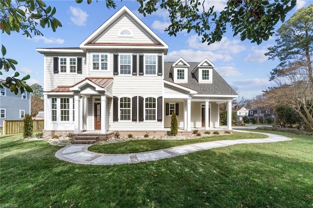 view of front of property featuring a front yard and fence