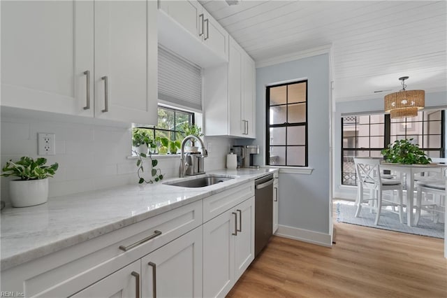 kitchen featuring sink, white cabinetry, dishwasher, light hardwood / wood-style floors, and backsplash