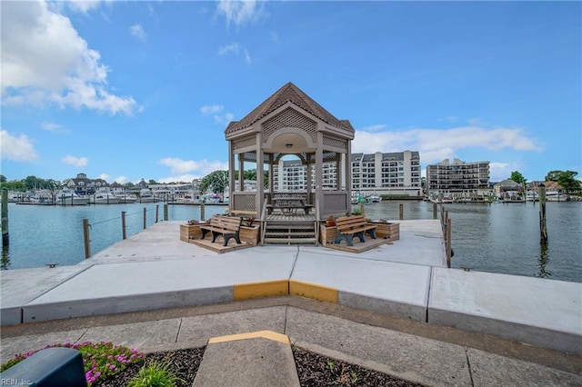 dock area with a gazebo and a water view