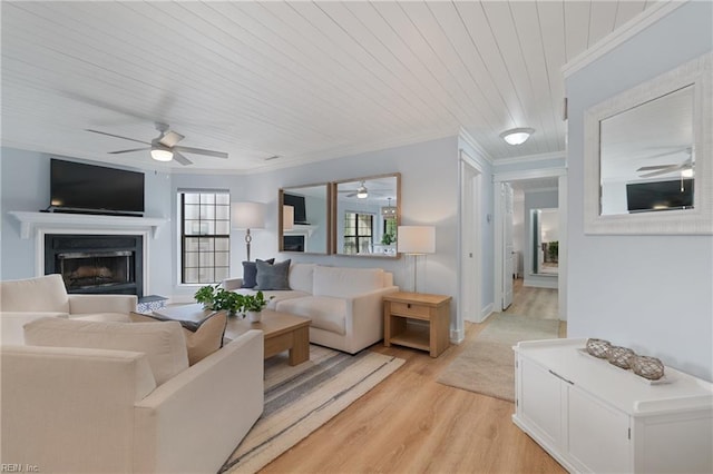 living room with crown molding, light hardwood / wood-style flooring, wooden ceiling, and ceiling fan