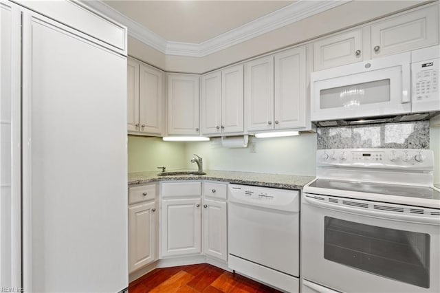 kitchen featuring sink, white cabinetry, ornamental molding, white appliances, and hardwood / wood-style floors