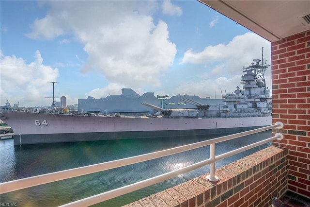 balcony featuring a water view