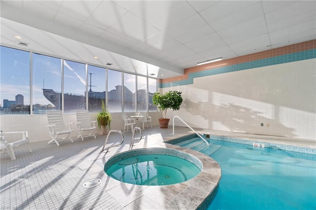 view of swimming pool featuring an indoor in ground hot tub