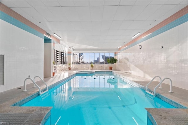 view of swimming pool featuring an indoor in ground hot tub