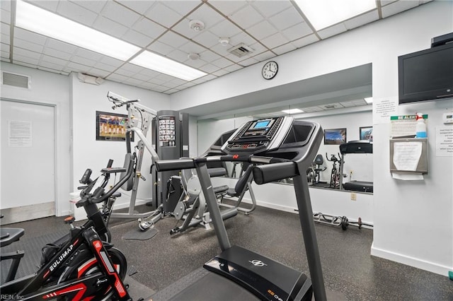 workout area with a drop ceiling