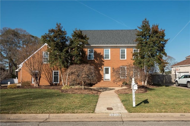 colonial home with a front yard