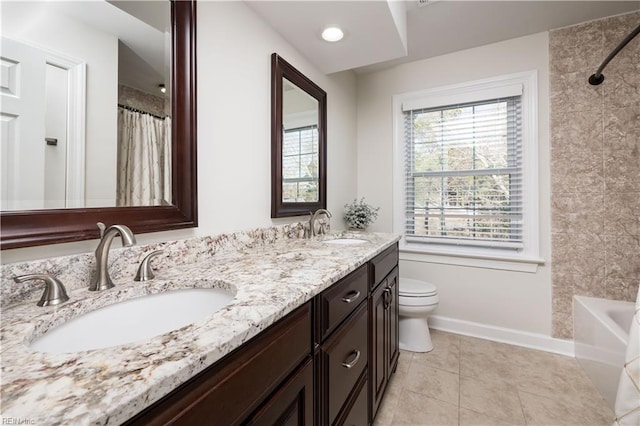 full bathroom with tile patterned flooring, vanity, washtub / shower combination, and toilet