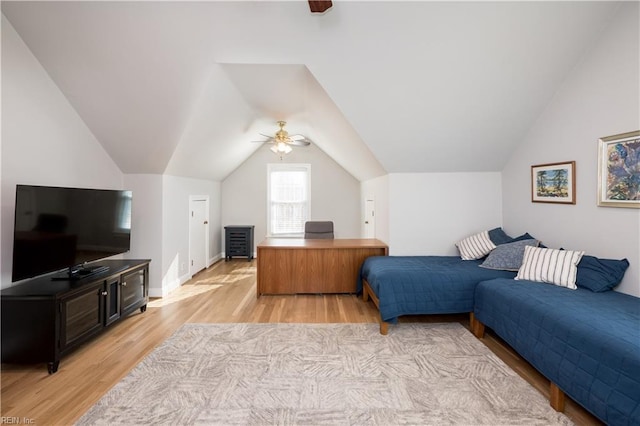 bedroom featuring ceiling fan, lofted ceiling, and light wood-type flooring