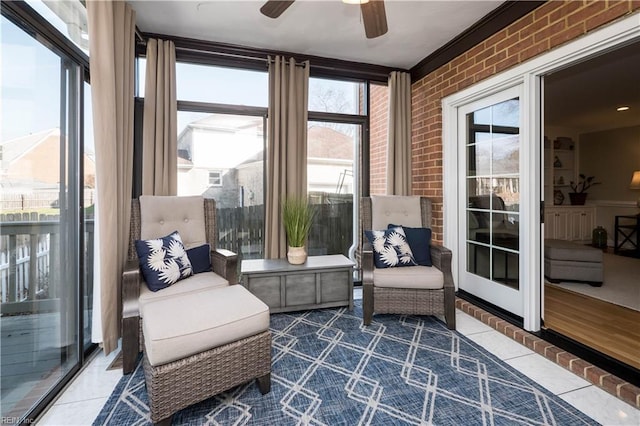 sunroom / solarium with ceiling fan